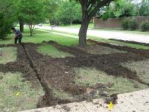 a sprinkler grid being dug out