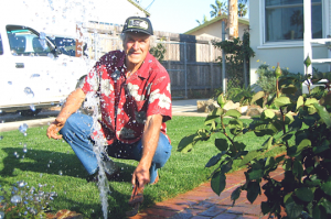 Allen sprinkler repair tech caps off a system line