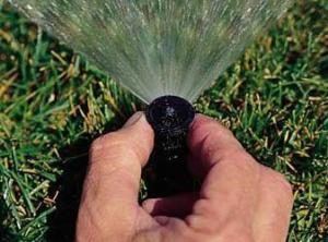 technician handles sprinkler repair in Allen, Texas